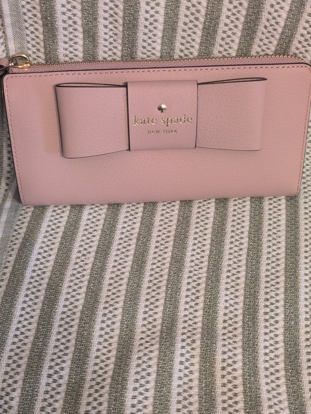 kate spade blush pink bow zip-around wallet